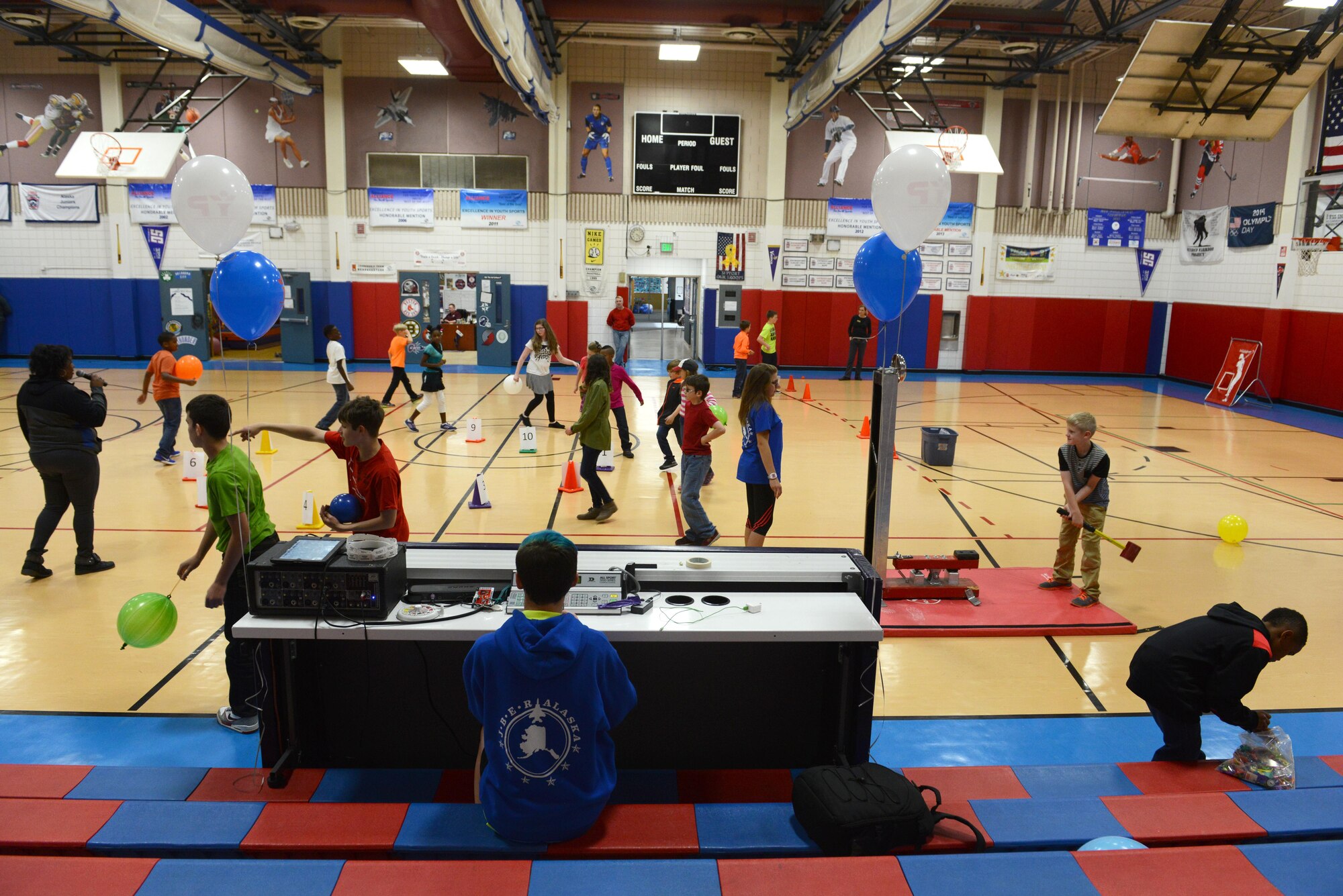 Children play various games during the Worldwide Day of Play at the Kennecott Youth Center at Joint Base Elmendorf-Richardson, Alaska, Sept. 21, 2016. The Worldwide Day of Play is an annual event that encourages kids and parents to go outside and play instead of sitting indoors and watching television. Due to inclement weather, the Kennecott Youth Center provided several games and stations like the cupcake walk, indoor rock climbing, batting cage, pitching mound and more.