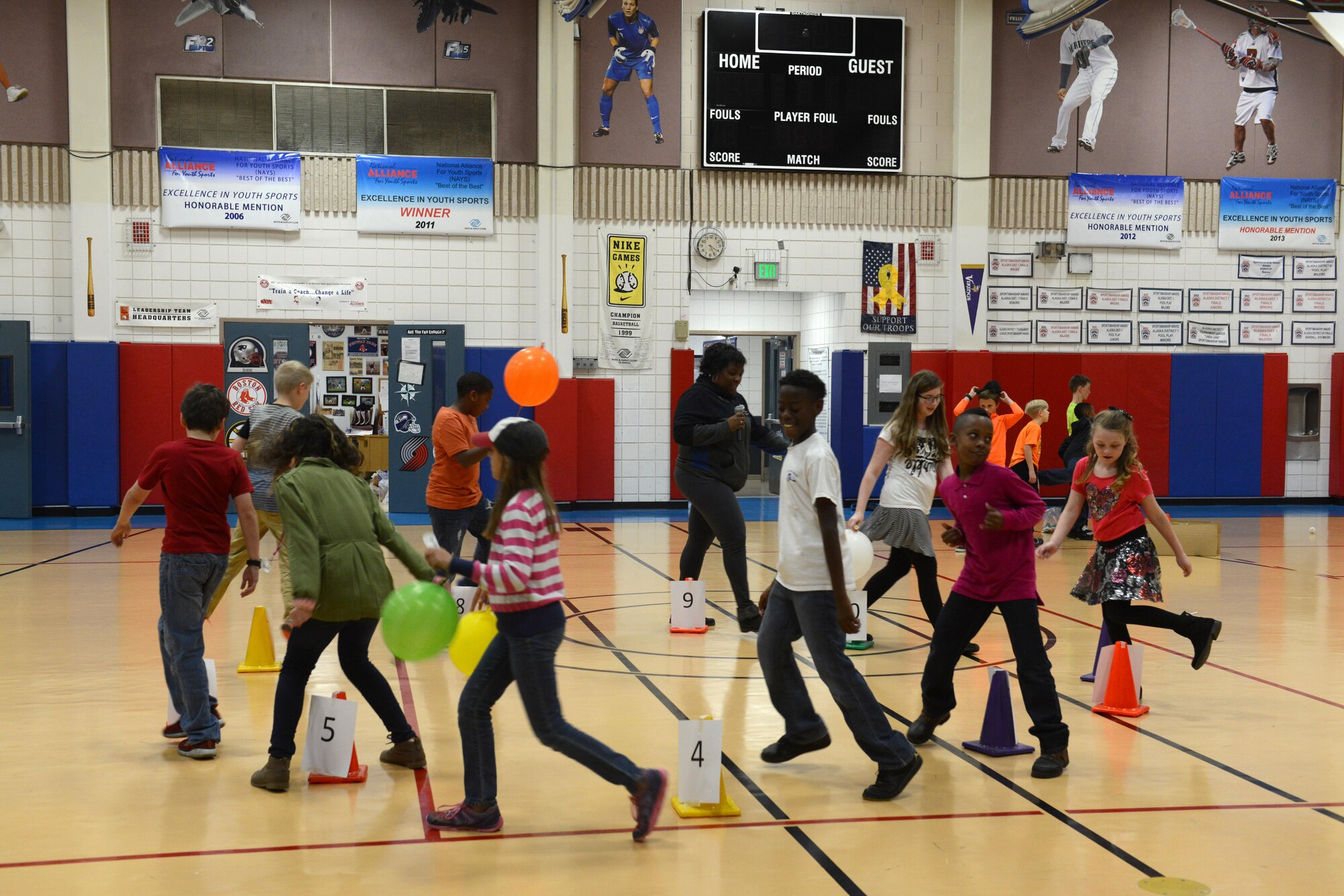 Children participate at a cupcake walk during the Worldwide Day of Play at the Kennecott Youth Center at Joint Base Elmendorf-Richardson, Alaska, Sept. 21, 2016. The Worldwide Day of Play is an annual event that encourages kids and parents to go outside and play instead of sitting indoors and watching television. Due to inclement weather, the Kennecott Youth Center provided several games and stations like the cupcake walk, indoor rock climbing, batting cage, pitching mound and more.