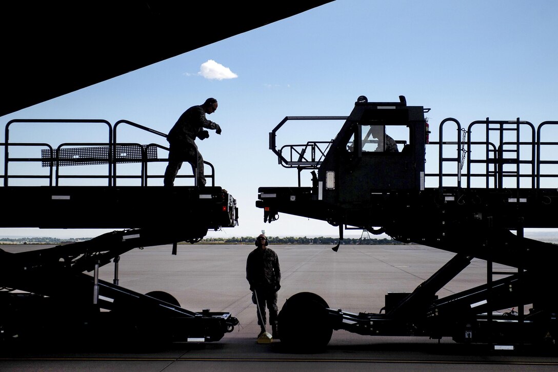 Airmen prepare to offload cargo from a C-5 Galaxy aircraft during Exercise Cerberus Strike 16-02 at the Fort Carson Air Terminal, Colo., Sept. 9, 2016. Air Force photo by Master Sgt. Joseph Swafford