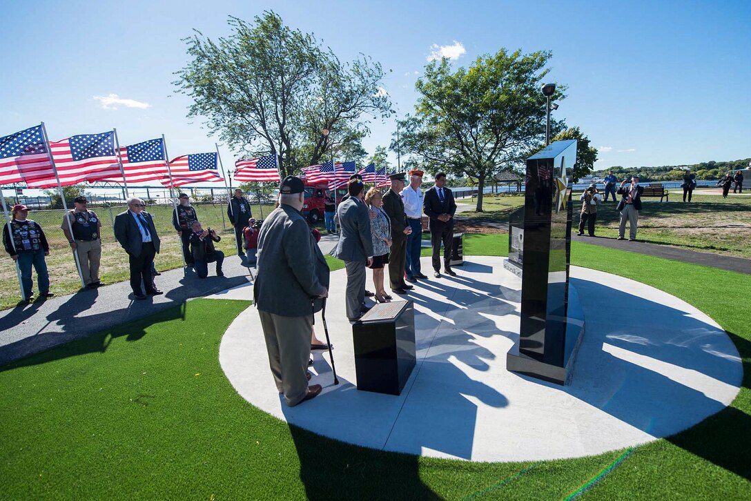 Marine Corps Gen. Joe Dunford, center, chairman of the Joint Chiefs of Staff, helps unveil the new Gold Star Families Memorial Monument in Fall River, Mass., Sept. 25, 2016. The memorial is a tribute to the Massachusetts families who lost loved ones in military service to the country. DoD Photo by Navy Petty Officer 2nd Class Dominique A. Pineiro