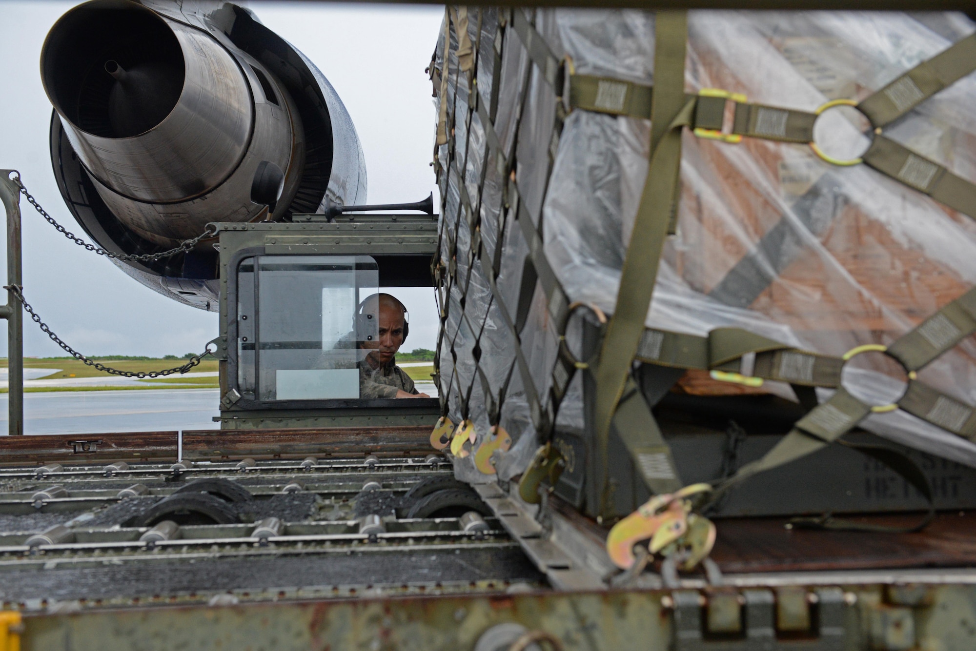 Kevin Mesa, 734th Air Mobility Squadron air freight service technician, operates a Tunner 60K aircraft cargo loader Sept. 7, 2016, at Andersen Air Force Base, Guam. The Tunner 60K aircraft cargo loader is capable of transporting up to six cargo pallets at a maximum speed of 23 mph. The vehicle’s deck elevates from 39 inches to 18 feet 6 inches high and employs a powered conveyor system to move cargo. (U.S. Air Force photo by Airman 1st Class Jacob Skovo)