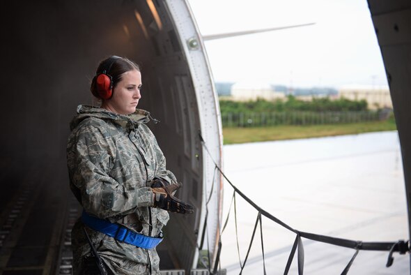 Senior Airman Hannah Stewart, 734th Air Mobility Squadron aircraft services technician, waits for an aircraft cargo loader Sept. 7, 2016, at Andersen Air Force Base, Guam. The 734th AMS provides humanitarian relief and rapid response capabilities in the event of a natural disaster within the Indo-Asia-Pacific region. (U.S. Air Force photo by Airman 1st Class Jacob Skovo)
