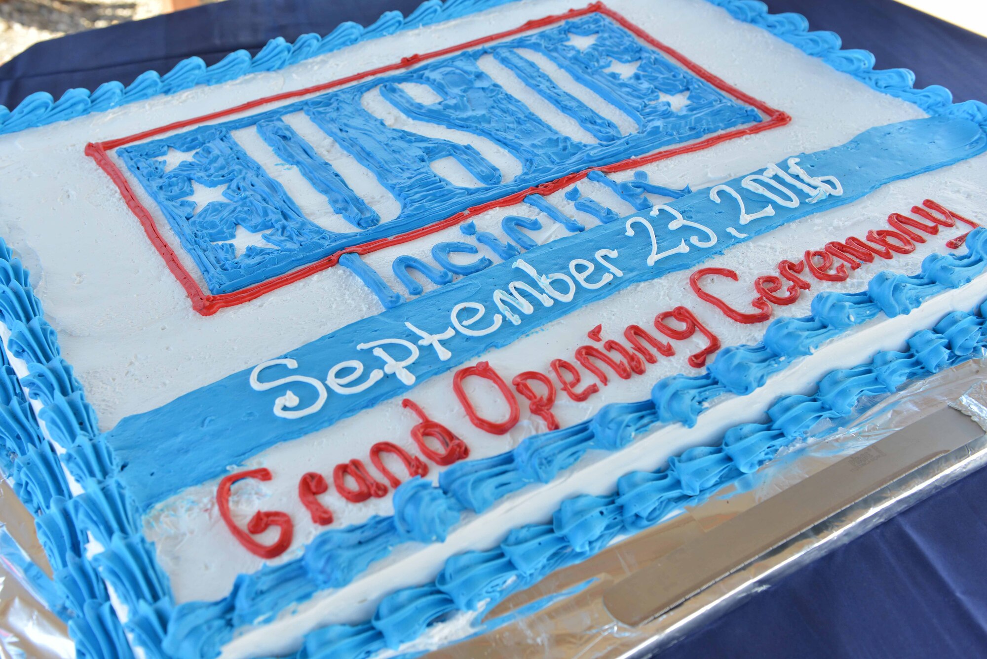 A cake is displayed for the USO Incirlik grand opening ceremony Sept. 23, 2016, at Incirlik Air Base, Turkey. In conjunction with the ceremony, the USO staff and volunteers provided personnel in attendance with cake and a cookout. (U.S. Air Force photo by Senior Airman John Nieves Camacho)