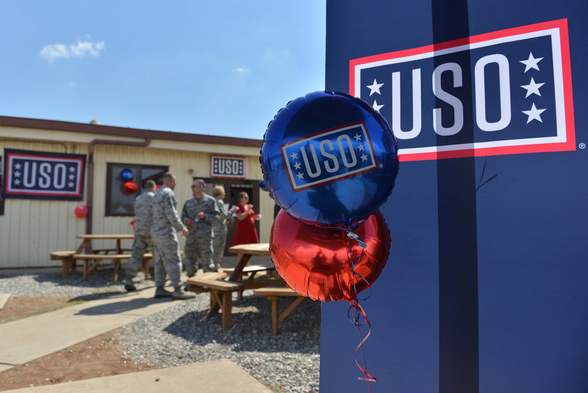 U.S. Airmen gather in front of USO Incirlik during its grand opening ceremony Sept. 23, 2016, at Incirlik Air Base, Turkey. USO Incirlik services U.S. and coalition forces by offering them Wi-Fi, space to watch TV, play games and meet new people. (U.S. Air Force photo by Senior Airman John Nieves Camacho)