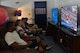 Servicemembers relax and play video games in USO Incirlik after its grand opening ceremony Sept. 23, 2016, at Incirlik Air Base, Turkey. Presently, USO Incirlik services nearly 350 individuals daily. (U.S. Air Force photo by Senior Airman John Nieves Camacho)