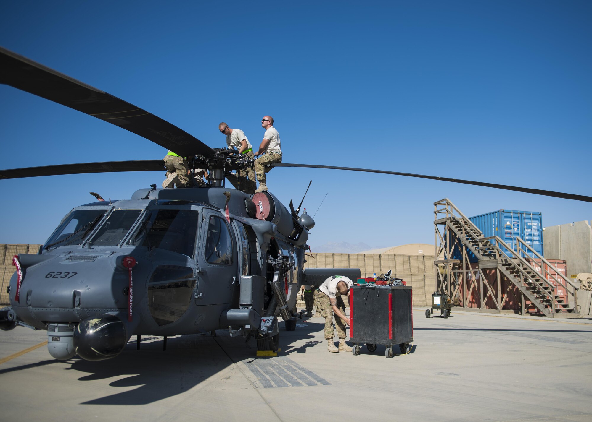 Airmen from the HH-60 Aircraft Maintenance Unit unfold the blades of a HH-60G Pave Hawk, Bagram Airfield, Afghanistan, Sept. 26, 2016. The 83rd ERQS provides the only U.S. personnel recovery assets in Afghanistan. HH-60G maintainers work a non-stop alert schedule and are ready to respond 24 hours a day, seven days a week. (U.S. Air Force photo by Senior Airman Justyn M. Freeman)