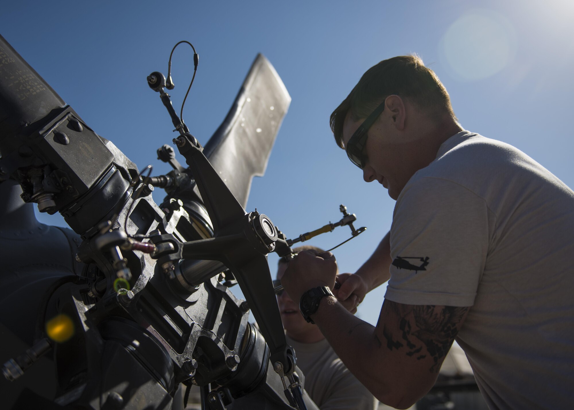 Staff Sgt. Sam Carroll, HH-60 Aircraft Maintenance Unit, unfolds a tail rotor, Bagram Airfield, Afghanistan, Sept. 26, 2016. The HH-60G is a derivative of the UH-60 Black Hawk and incorporates the US Air Force Precision Avionics Vectoring Equipment with its main mission to insert and recover isolated personnel. (U.S. Air Force photo by Senior Airman Justyn M. Freeman)
