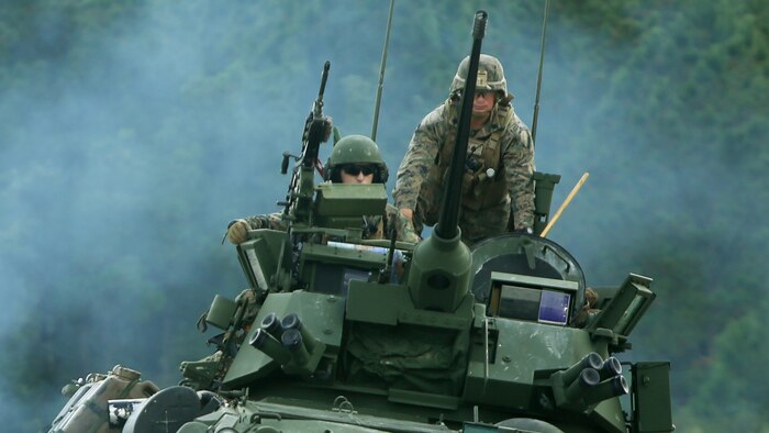 Marines from 2nd Light Armored Reconnaissance Battalion head out to simulate a battalion coil on a Light Armored Vehicle 25 during a combined weapons range at Marine Corps Base Camp Lejeune, N.C., Sept. 20-21, 2016. A battalion coil is formed when all of the vehicles in play line up in a row to attack any oncoming enemy. The training increased the Marines’ proficiency on various weapons platforms and improved their tactical mindset. Instead of focusing on one skill, this training combined multiple weapon systems and vehicles to show the Marines how to use each asset effectively and accomplish the mission.