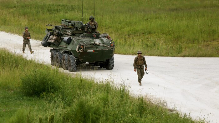 Marines from 2nd Light Armored Reconnaissance Battalion walk back from a machine gun shoot during a combined weapons range at Marine Corps Base Camp Lejeune, N.C., Sept. 20-21, 2016. The training increased the Marines’ proficiency on various weapons platforms and improved their tactical mindset. Instead of focusing on one skill, this training combined multiple weapon systems and vehicles to show the Marines how to use each asset effectively and accomplish the mission.
