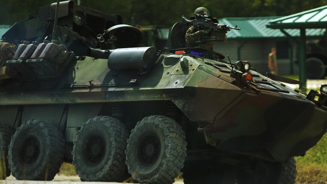 A Marine with 2nd Light Armored Reconnaissance Battalion rides a Light Armored Vehicle Anti-Tank onto a range during a combined weapons range at Marine Corps Base Camp Lejeune, N.C., Sept. 20-21, 2016. The LAV-AT uses Tube-launched, Optically tracked, Wire-guided missiles to fight tanks during battle. The training increased the Marines’ proficiency on various weapons platforms and improved their tactical mindset. Instead of focusing on one skill, this training combined multiple weapon systems and vehicles to show the Marines how to use each asset effectively and accomplish the mission.