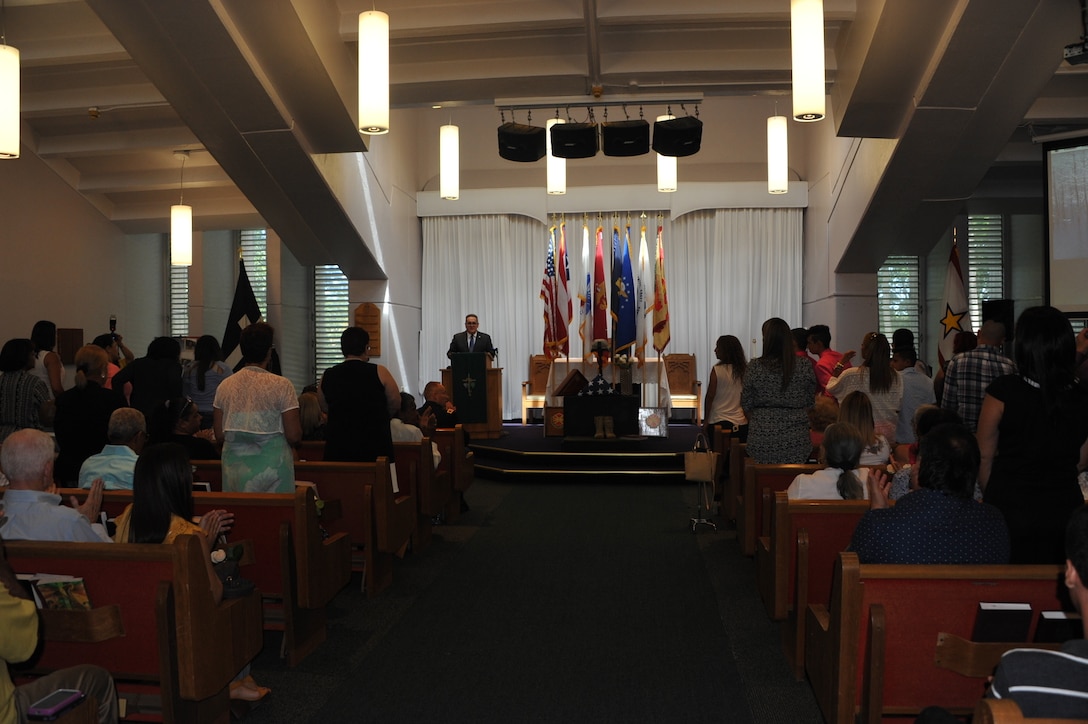 Mr. Edwin Ramos-Jourdan, coordinator for Survivor Outreach Services (SOS), welcomes the Gold Star Mothers and Survivors to the Chapel at Fort Buchanan, Puerto Rico. The SOS is an Army Community Service program designed to provide short-term and long-term support for the Survivors of Fallen Soldiers. SOS connects Family members with people who can help them cope with their loss. This program embraces and reassures Survivors that they are continually linked to the Army Family for as long as they desire.