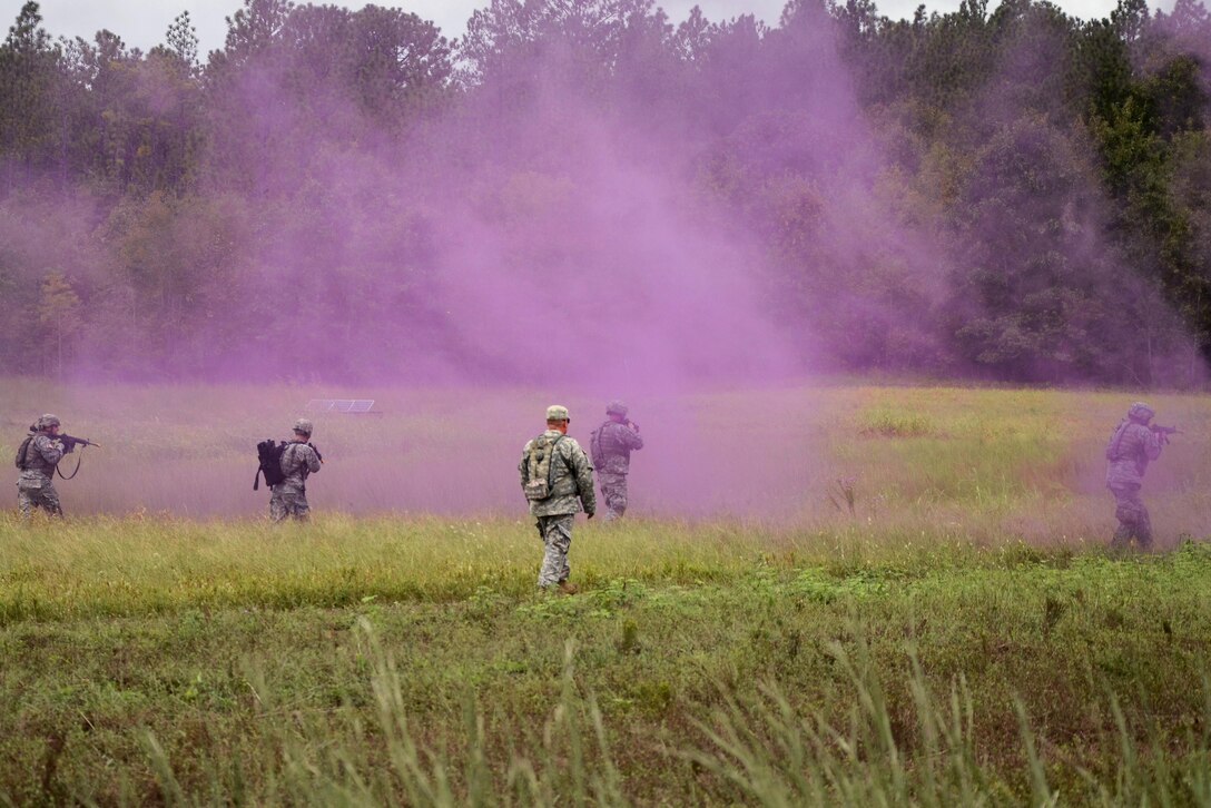 Soldiers patrol after advancing under the cover of smoke during training at McCrady Training Center in Eastover, S.C., Sept. 20, 2016. Army National Guard photo by 1st Lt. Jessica Donnelly