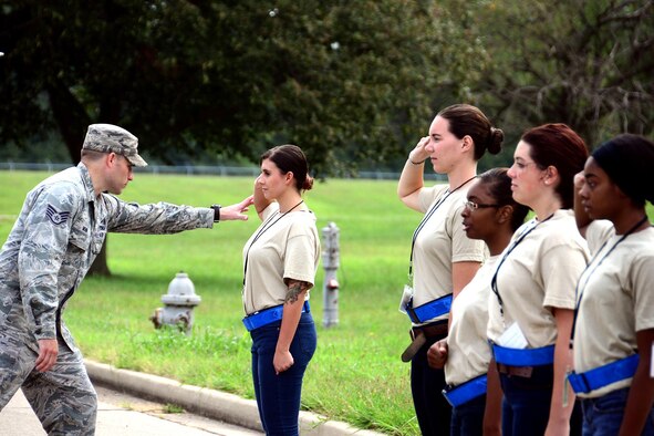Staff Sgt. Tyler Mohr, 445th Airlift Wing command post controller, instructs trainees from the 445th Development and Training Flight on proper saluting techniques during the August 20, 2016 unit training assembly at Wright-Patterson Air Force Base, Ohio. (U.S. Air Force photo/Army Master Sgt. D. Keith Johnson) 