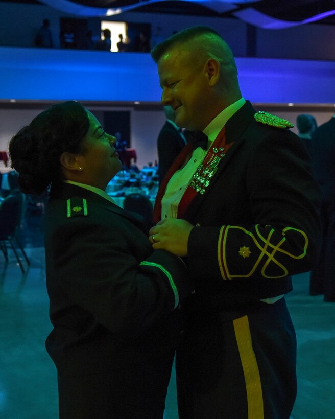 U.S. Air Force Maj. Christina Encina, 7th Medical Support Squadron diagnostics flight commander, dances with her husband, retired Army Maj. Ronald Brosius, during the Air Force Ball at the Abilene Civic Center in Abilene, Texas. More than 600 Dyess patrons and Abilene community partners attended the event to commemorate the Air Force's 69th birthday. (U.S. Air Force photo by Senior Airman Kedesha Pennant)