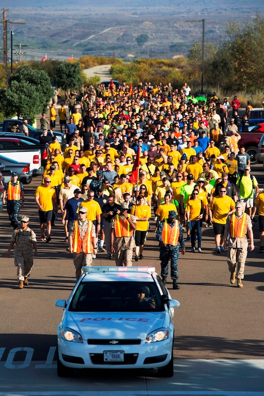 Marines and Sailors follow the pace car at the start of the 2nd annual Suicide Awareness and Prevention Walk aboard Camp Pendleton, Calif., Sept. 23, 2016. The walk was held to increase awareness about suicide and highlight the resources available to help those in need. (U.S. Marine Corps photo by Sgt. Abbey Perria)