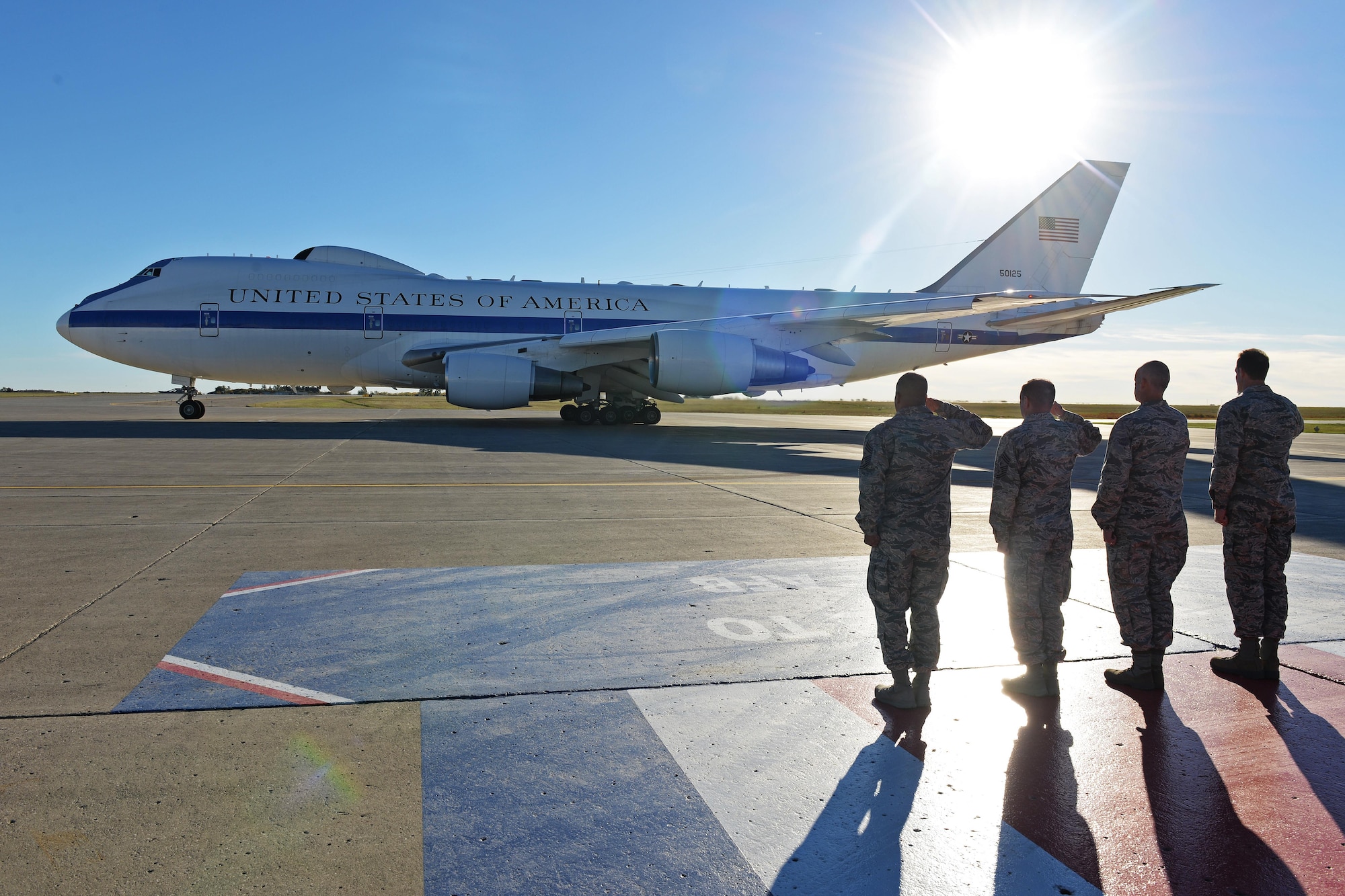 Team Minot leadership salutes U.S. Secretary of Defense Ashton Carter’s aircraft at Minot Air Force Base, N.D., Sept. 26, 2016. Carter spoke with Airmen from the 5th BW and 91st MW and toured several facilities to include a missile alert facility and a B-52H Stratofortress static display. To conclude his visit, Carter hosted a question and answer session with base personnel and recognized top performing Airmen. (U.S. Air Force photo/Airman 1st Class J.T. Armstrong)