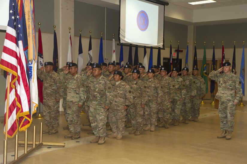 BARRIGADA, Guam - U.S. Army reserve Soldiers with Detachment 5, 368th Military Police, 9th Mission Support Command, salute the colors during the playing of the National Anthem at the Guam Army National Guard Assembly Hall, Saturday, Sept. 24. The Soldiers are scheduled to deploy to the Middle East this fall in support of military operations.