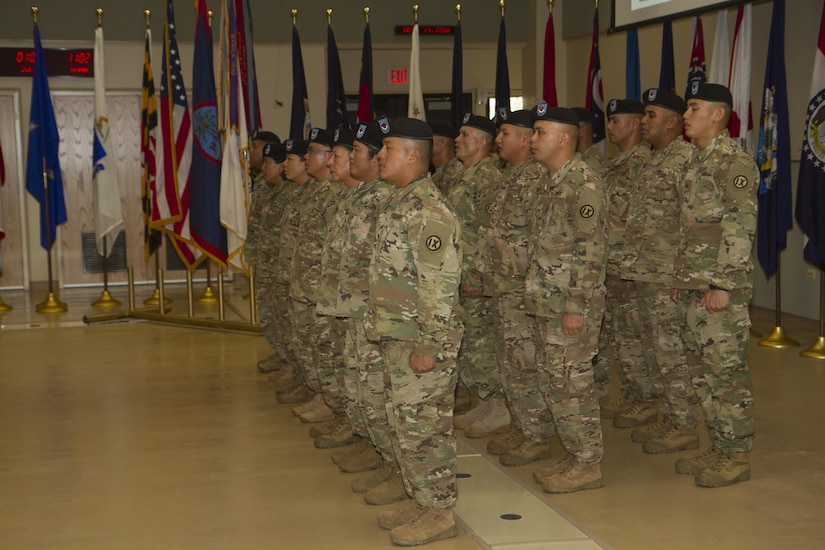 BARRIGADA, Guam – Soldiers with Detachment 5, 368th Military Police, 9th Mission Support Command, sing the Army Song to conclude their deployment ceremony at the Guard Army National Guard Assembly Hall on Saturday, Sept. 24.