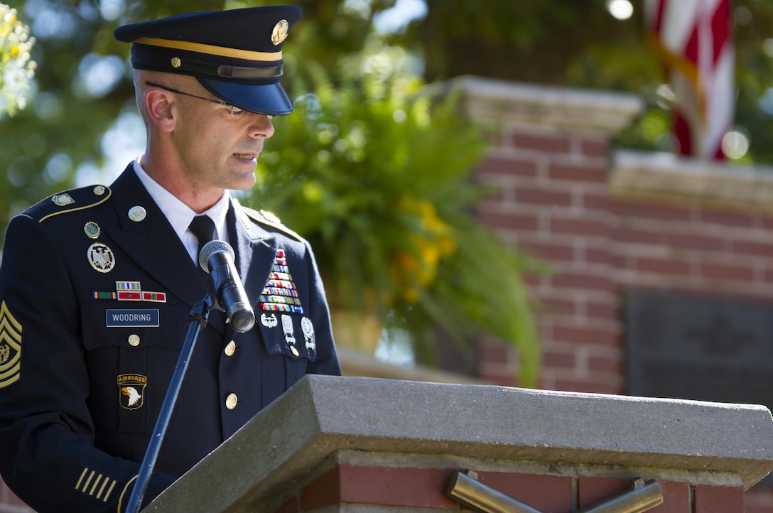 Command Sgt. Maj. Richard Woodring, the senior enlisted Soldier in the Military Police Corps Regiment, speaks during its Memorial Tribute Sept. 19 at Fort Leonard Wood, Missouri. MPs attended events throughout the week to mark the regiment's 75th anniversary. (U.S. Army photo by Sgt. 1st Class Jacob Boyer/Released)