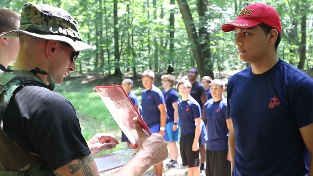 Brian Copa, right, is promoted by U.S. Marine Staff Sgt. Nicholas Safran, left, to the rank of private first class Aug. 20 at Sugarloaf Mountain in Urbana, Maryland, for his efforts in aiding the recruiting mission. Brian Copa is from Silver Spring, Maryland, and Safran is the staff noncommissioned officer in charge of Recruiting Sub-station Rockville, Recruiting Station Frederick. (Official U.S. Marine Corps Photo by Sgt. Anthony J. Kirby/Released)