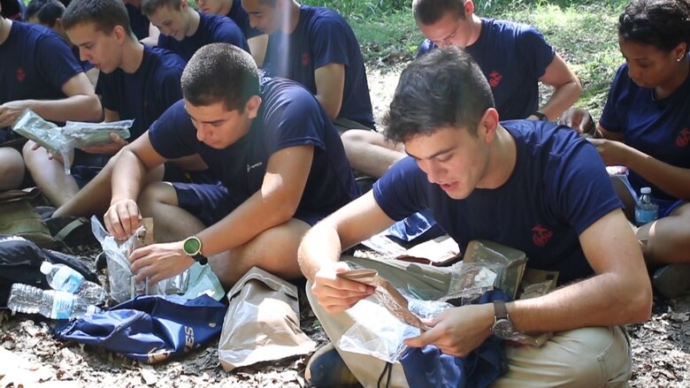 U.S. Marine applicants in the Delayed Entry Program observe the contents of their Meal-Ready-To-Eat during a break from a hike Aug. 20 at Sugarloaf Mountain in Urbana, Maryland. The applicants, from Recruiting Sub-station Rockville, Recruiting Station Frederick, were also given two bottles of water and a sports drink to get through the 3.31-mile hike. (Official U.S. Marine Corps Photo by Sgt. Anthony J. Kirby/Released)