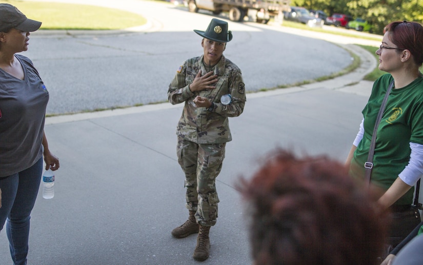 Staff Sgt. Coylan Velez, a drill sergeant with Company D, 795th Military Police Battalion from North Bergen, New Jersey, speaks to her group Sept. 20 before the MP Spouses Challenge at Fort Leonard Wood, Missouri. MPs attended events throughout the week to mark the regiment's 75th anniversary. (U.S. Army photo by Sgt. 1st Class Jacob Boyer/Released)