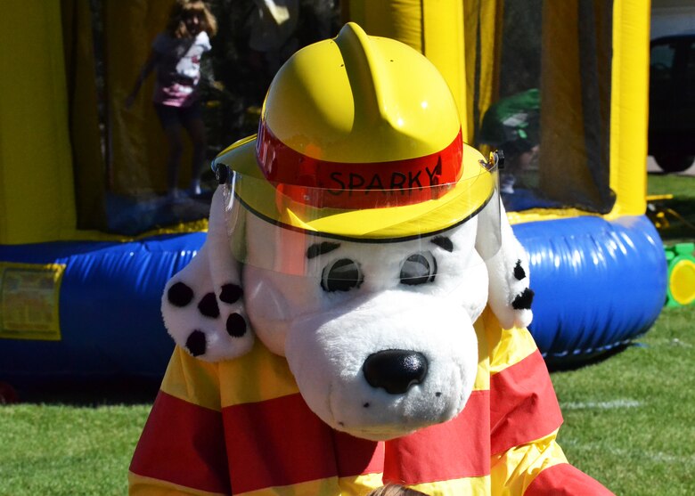 “Sparky” the fire dog meets and interacts with attendees during the Worldwide Day of Play event at Peterson Air Force Base, Colorado, Saturday, Sept. 24, 2016. The Peterson Fire Department was one of many agencies providing information and interactive demonstrations during the event. (U.S. Air Force photo/Brian Hagberg)