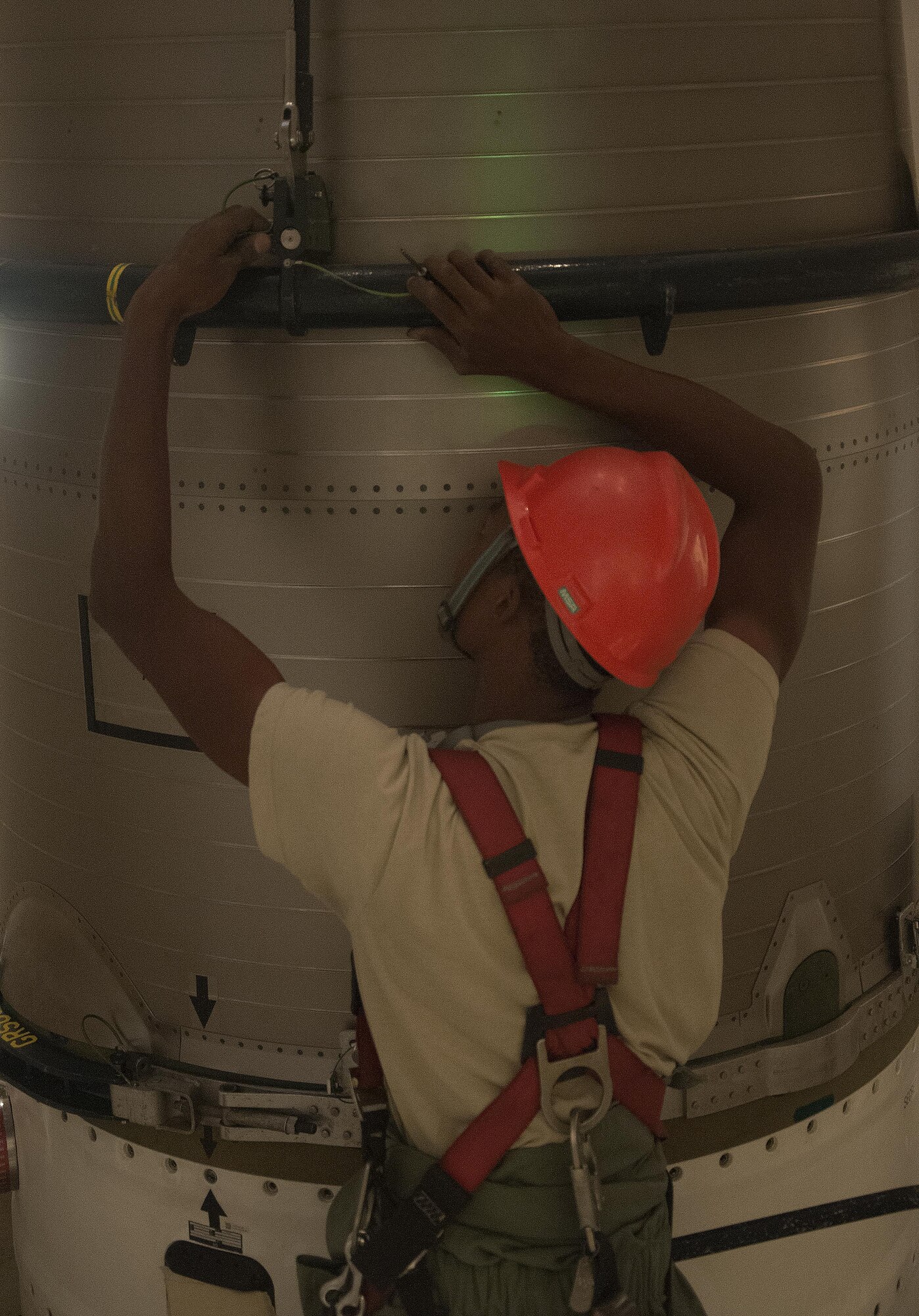 Airman 1st Class Jaylon Stanley, 90th Missile Maintenance Squadron maintainer, connects the reentry system handling fixture to the reentry system of a Minuteman III ICBM inside a launch facility in the F.E. Warren Air Force Base, Wyo., missile complex, Aug. 24, 2016. Once completely secured, the RS was hoisted into a payload transporter to allow maintainers to work on other portions of the ICBM. The 90th MMXS maintains 150 Minuteman III ICBMs and the associated LFs spread throughout three states and 9,600 square miles. (U.S. Air Force photo by Senior Airman)