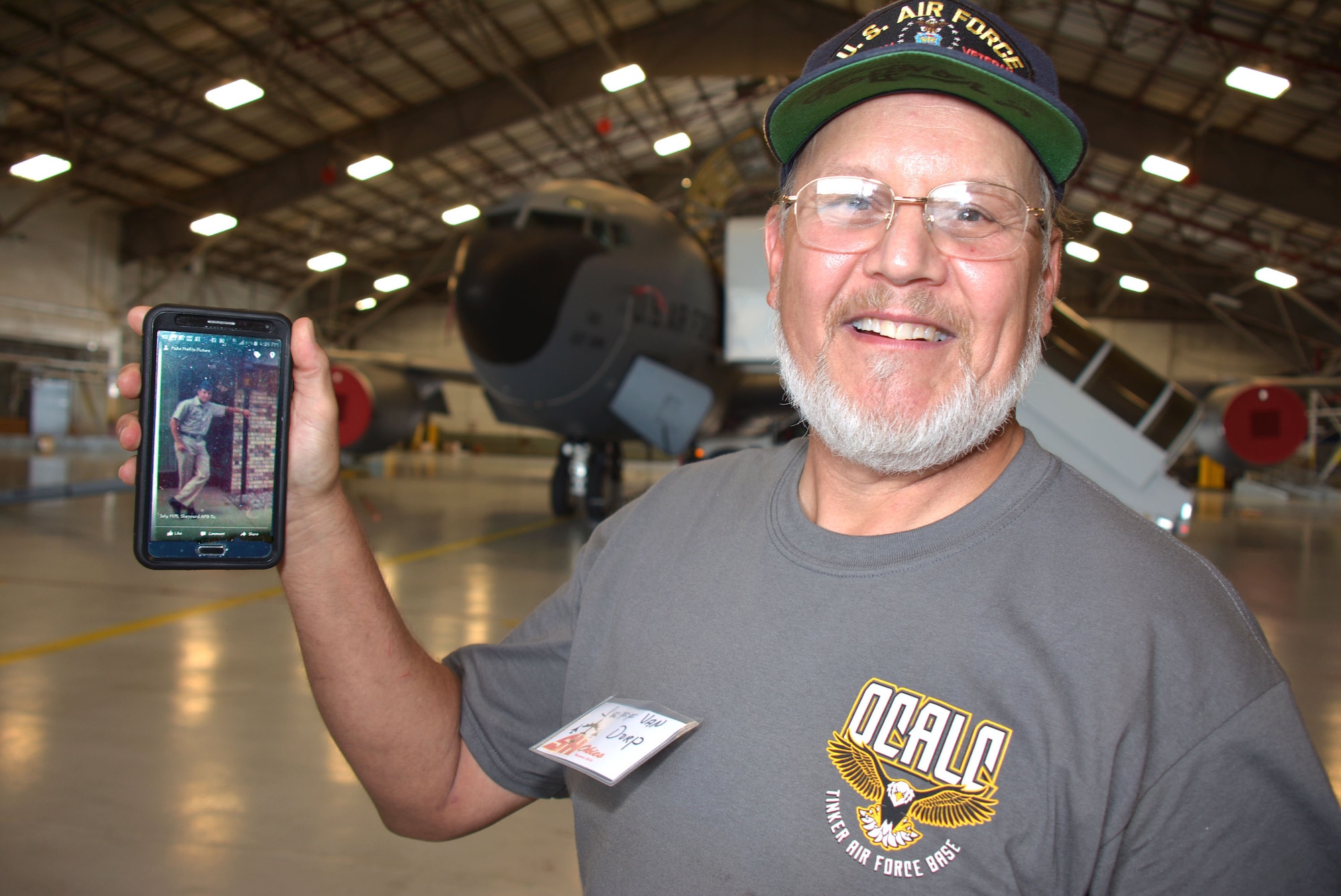 Jeff Van Dorp showcases a photo of himself, Airman Van Dorp from 1975 at the “SH Okie” reunion Sept. 23 in the 507th Air Refueling Wing Hangar 1030. Van Dorp served in the Aerial Repair and Isochronal Inspection shop in the wing from 1981-2008 and currently works in maintenance in the Air Logistics Center as a civil service civilian. (U.S. Air Force Photo/Maj. Jon Quinlan)       