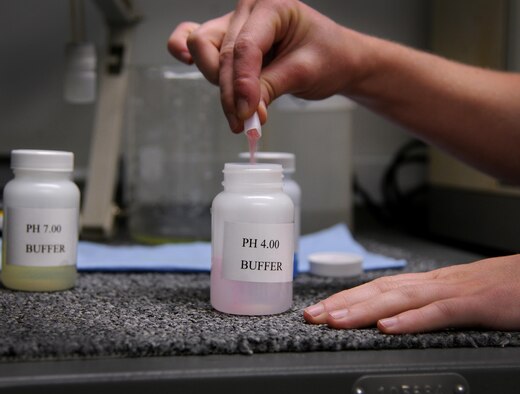 Senior Airman Shana Wojcik, the 9th Intelligence Squadron quality assurance section lead, mixes a solution that aids in chemical testing Sept. 14, 2016, at Beale Air Force Base, Calif. The quality assurance section is responsible for ensuring the film is developed properly by the chemicals within the Versamat 1140 film processor. (U.S. Air Force photo/Airman 1st Class Taylor A. Workman)