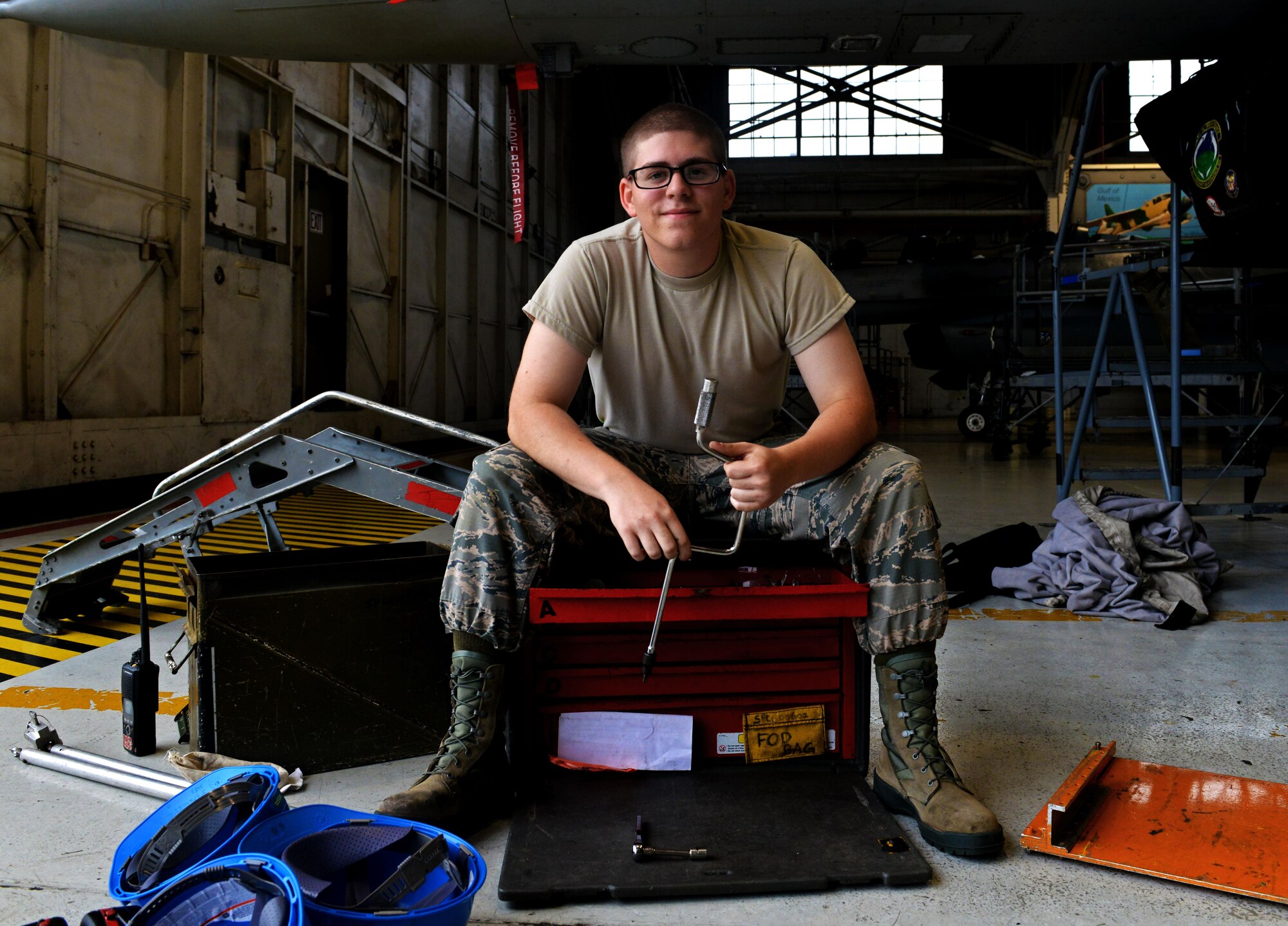 U.S. Air Force Airman 1st Class Caleb Martinkovic, 20th Component Maintenance Squadron egress apprentice, sits among his equipment at Shaw Air Force Base, S.C., Sept. 22, 2016. The 20th CMS egress flight ensures the safety of Team Shaw pilots as well as the F-16s assigned here by checking the function of the ejection system. (U.S. Air Force photo by Airman 1st Class Destinee Sweeney)
