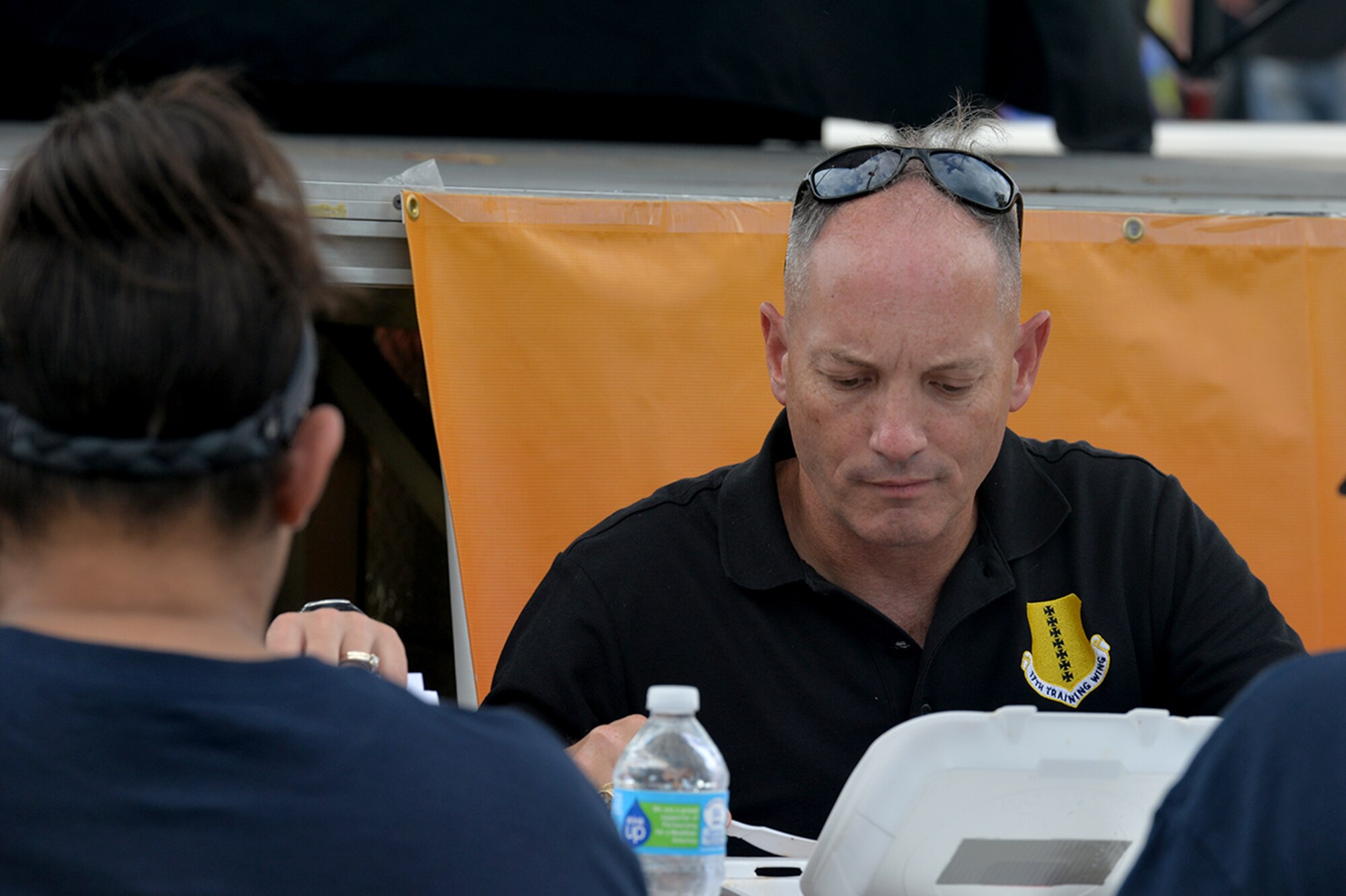 U.S. Air Force Col. Michael Downs, 17th Training Wing Commander, judges food for the 43rd Annual Armed Forces Chili Cook-Off during the Ruckus at the Rec Camp at the Goodfellow Air Force Base Recreation Camp, San Angelo, Texas, Sept. 24, 2016. The competition includes categories for teams and individuals in the Terlingua, chicken, ribs, beans or "anything goes" categories. (U.S. Air Force photo by Airman 1st Class Randall Moose/Released)