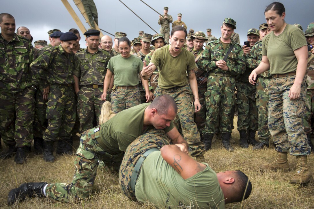 Marines grapple with soldiers from Romania, Moldovia, Bulgaria and Slovakia during Exercise Platinum Lynx at Babadag Training Area, Romania, Sept. 19, 2016. The troops are part of the Black Sea Rotational Force, which deploys annually in the Black Sea, Balkan and Caucasus regions. Marine Corps photo by Lance Cpl. Timothy J. Lutz
