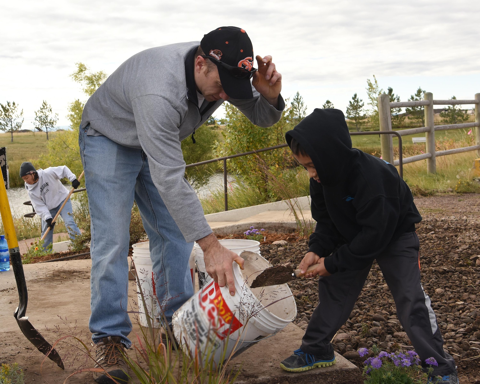 Volunteers scoop dirt during National Public Lands Day Sept. 24, 2016, at Malmstrom Air Force Base. NPLD is a day dedicated to encouraging recreation, volunteering and encouraging the use of public lands for education. (U.S. Air Force photo/Senior Airman Jaeda Tookes)