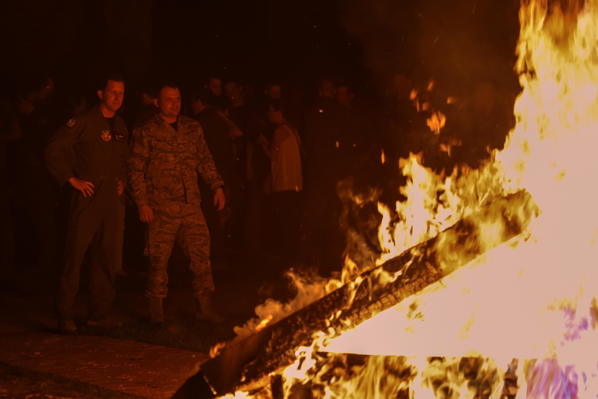 Col. Christopher Sage (left), 4th Fighter Wing commander, and Chief Master Sgt. Shane Wager, 4th FW command chief, watch pianos burn during a Battle of Britain event, Sept. 23, 2016, at Seymour Johnson Air Force Base, North Carolina. The 334th, 335th and 336th Fighter Squadrons can all trace their lineage back to World War II and the British Royal Air Force. (U.S. Air Force photo by Airman Shawna L. Keyes)