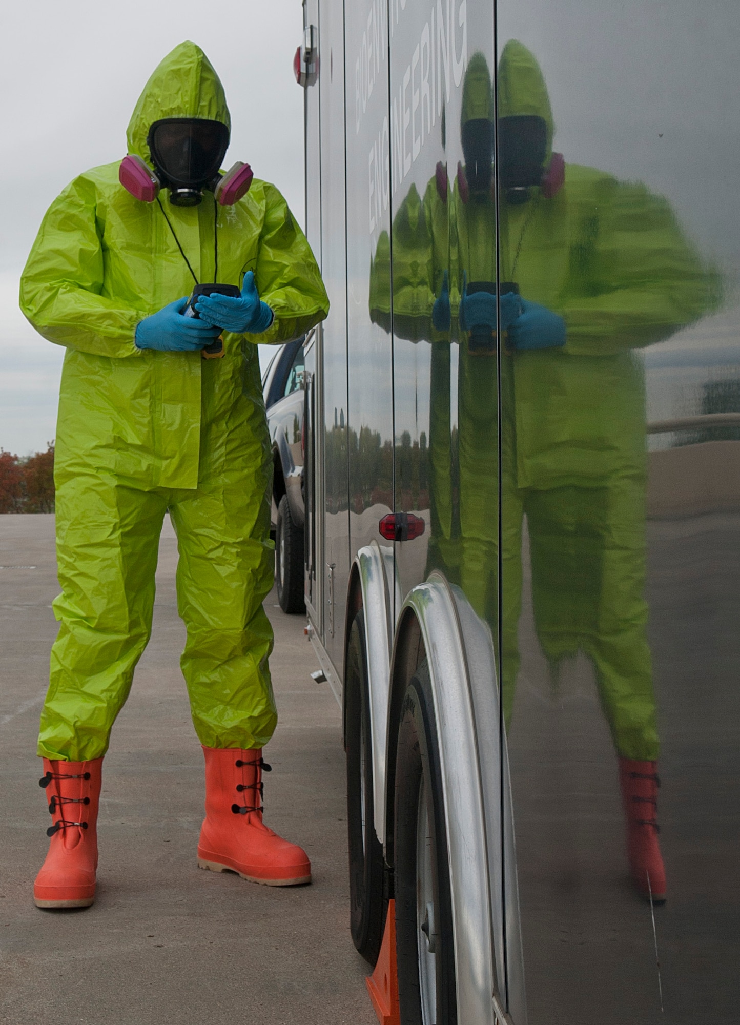Senior Airman Isaac Darko, a bioenvironmental engineering technician with the 5th Medical Group, checks the air for any chemicals or contamination at Minot Air Force Base, N.D., Sept. 22, 2016. The chemical suits are capable of holding air for up to 60 minutes after the Airmen get into the suit, depending on their lung capacity and volume. (U.S. Air Force photo/Airman 1st Class Jonathan McElderry)
