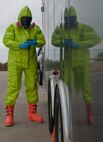 Senior Airman Isaac Darko, a bioenvironmental engineering technician with the 5th Medical Group, checks the air for any chemicals or contamination at Minot Air Force Base, N.D., Sept. 22, 2016. The chemical suits are capable of holding air for up to 60 minutes after the Airmen get into the suit, depending on their lung capacity and volume. (U.S. Air Force photo/Airman 1st Class Jonathan McElderry)