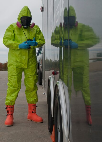 Senior Airman Isaac Darko, a bioenvironmental engineering technician with the 5th Medical Group, checks the air for any chemicals or contamination at Minot Air Force Base, N.D., Sept. 22, 2016. The chemical suits are capable of holding air for up to 60 minutes after the Airmen get into the suit, depending on their lung capacity and volume. (U.S. Air Force photo/Airman 1st Class Jonathan McElderry)