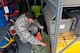 Senior Airman Nicholas Arvelo, a bioenvironmental engineering technician with the 5th Medical Group, stores away chemical gear at Minot Air Force Base, N.D., Sept. 22, 2016. The three main sections of what bioenvironmental engineering technicians focus on are occupational, environmental and emergency response. (U.S. Air Force photo/Airman 1st Class Jonathan McElderry)
