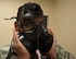 Senior Airman Nicholas Arvelo, a bioenvironmental engineering technician with the 5th Medical Group, performs a seal check for a protective mask at Minot Air Force Base, N.D., Sept. 22, 2016. A seal check is performed to ensure that no air leaks inside the mask during a breathing test. (U.S. Air Force photo/Airman 1st Class Jonathan McElderry)