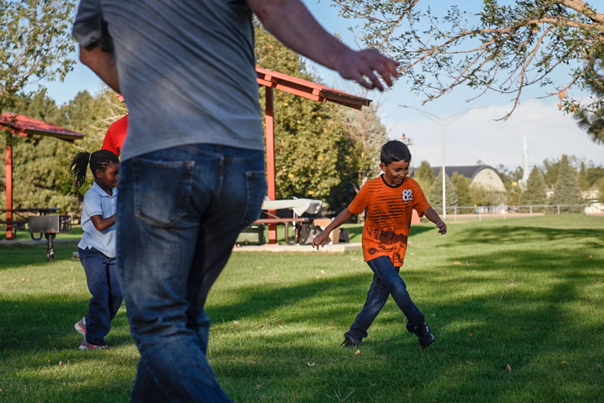 PETERSON AIR FORCE BASE, Colo. – Chris Pfeifer does the “grapevine” in a relay event against his father during the Family Fun Night at Lyon’s Park on Peterson Air Force Base, Colo., Sept. 22, 2016. The event consisted of an hour of physical activity followed by healthy food to demonstrate the “5-2-1-0” initiative put on by the Health and Wellness Center. (U.S. Air Force photo by Senior Airman Rose Gudex)