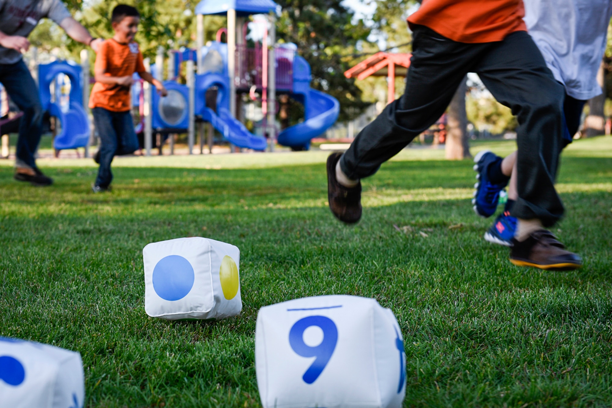 PETERSON AIR FORCE BASE, Colo. – Peterson youth and parents compete to see who is the quickest to complete a game during the Family Fun Night at Lyon’s Park on Peterson Air Force Base, Colo., Sept. 22, 2016. The event encouraged families to try the “5-2-1-0” plan in an effort to keep kids healthy and active. (U.S. Air Force photo by Senior Airman Rose Gudex)