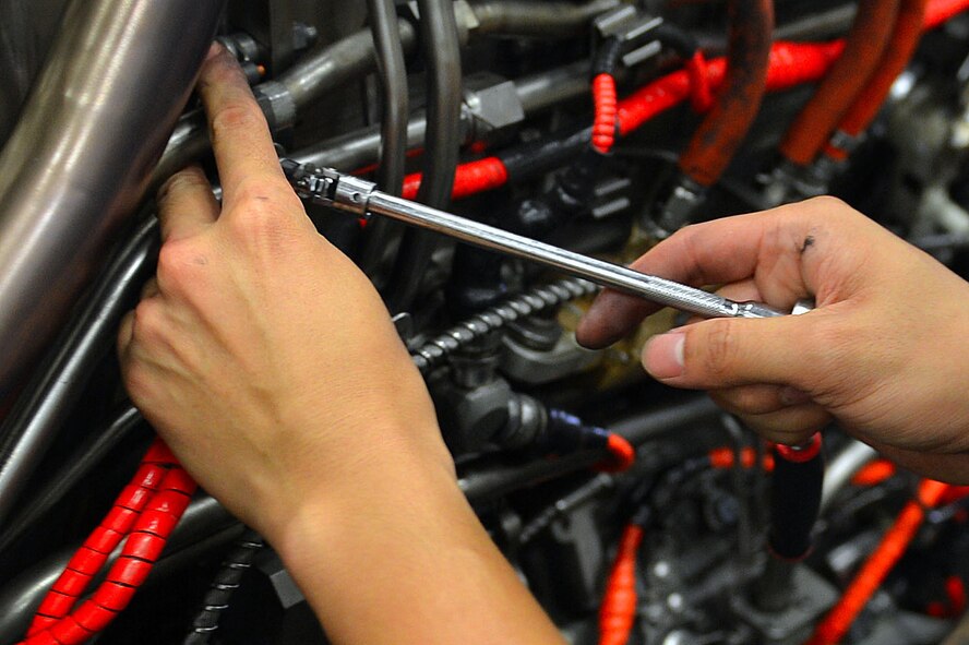 U.S. Air Force Airman 1st Class Jaymie Ivan Sanarez, 20th Component Maintenance Squadron aerospace propulsion journeyman, tightens screws on an F-16CM Fighting Falcon engine at the 20th CMS engine test facility at Shaw Air Force Base, S.C., Sept. 26, 2016. Airmen assigned to the 20th CMS engine test facility perform engine checks as part of routine aircraft maintenance. (U.S. Air Force photo by Airman 1st Class Christopher Maldonado)