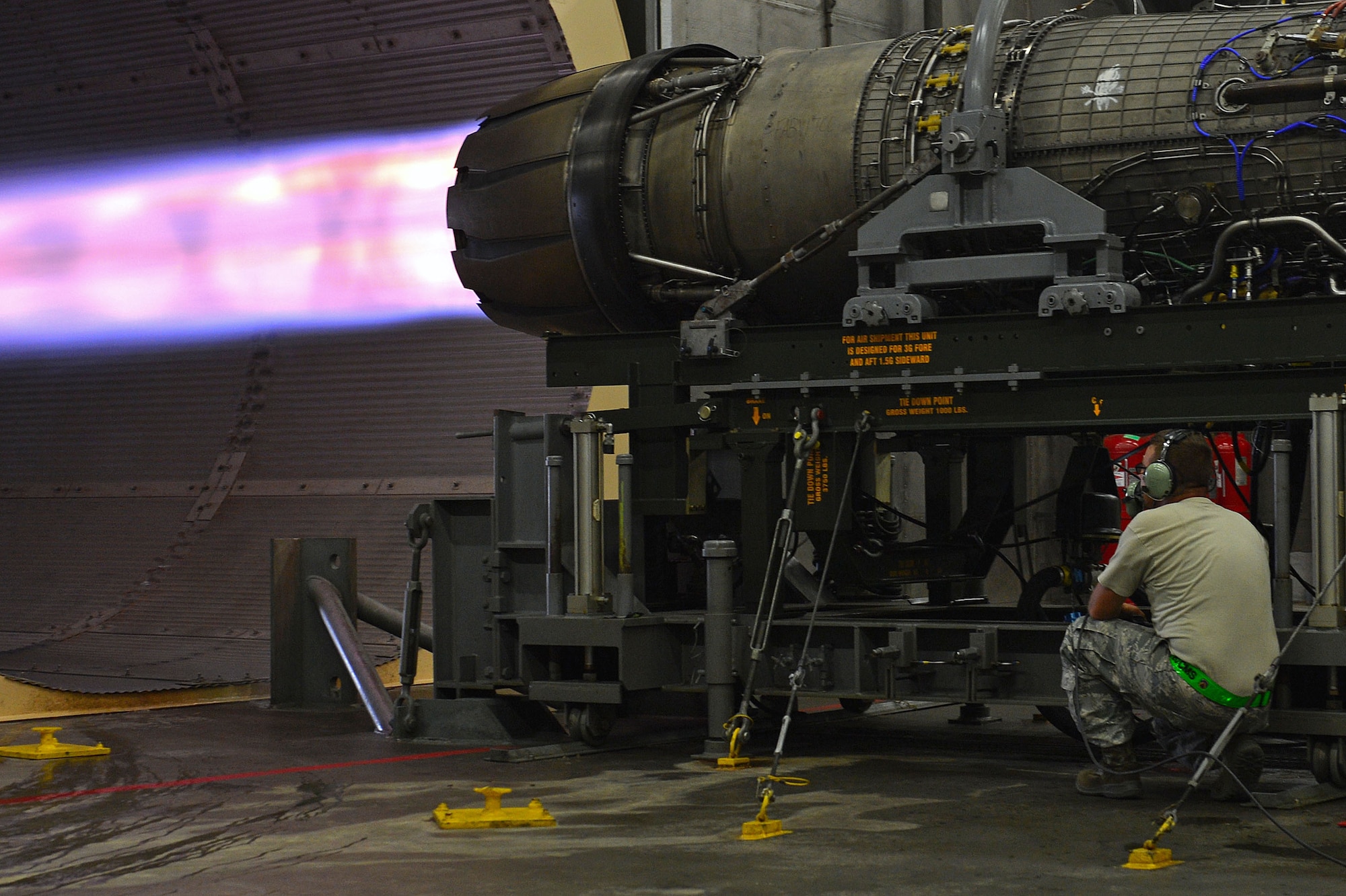 U.S. Air Force Staff Sgt. Dale Rodgers, 20th Component Maintenance Squadron aerospace propulsion craftsman, examines an afterburner during an F-16CM Fighting Falcon engine check at the 20th CMS engine test facility at Shaw Air Force Base, Sept. 26, 2016. An F-16 engine in full afterburn utilizes a thrust of 32,000 pounds to propel it into flight. (U.S. Air Force photo by Airman 1st Class Christopher Maldonado) 