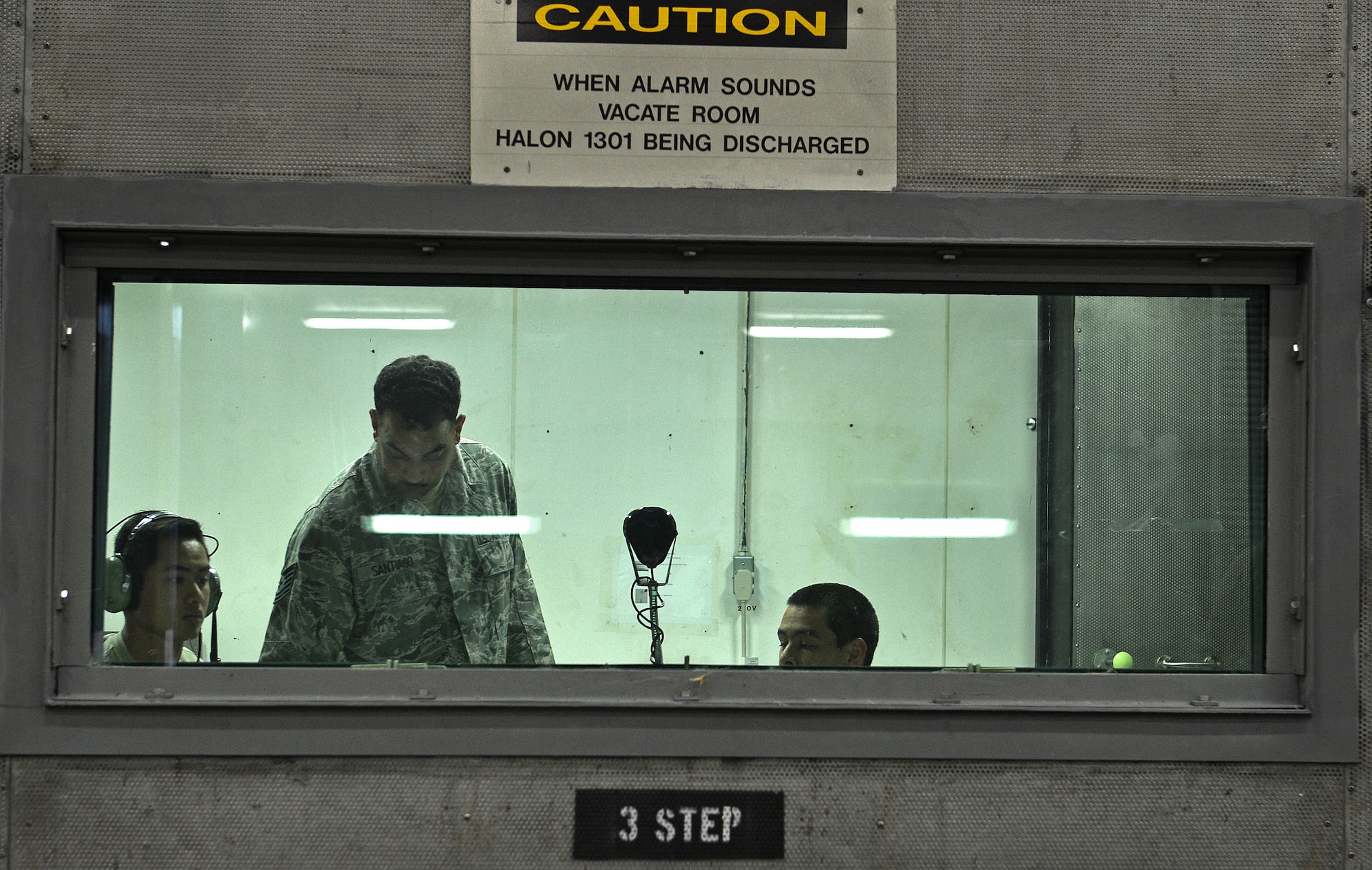 U.S. Airmen assigned to the 20th Component Maintenance Squadron aerospace propulsion flight communicate over speaker with a jet engine mechanic during an F-16CM Fighting Falcon engine check at the 20th CMS engine test facility at Shaw Air Force Base, S.C., Sept. 26, 2016. Communication between the jet engine mechanic and the command station allows the mechanic to safely complete the engine check. (U.S. Air Force photo by Airman 1st Class Christopher Maldonado)