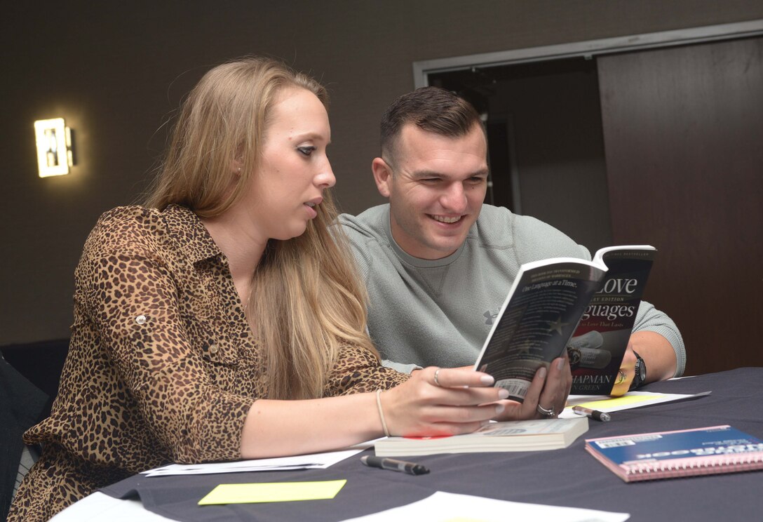 Senior Airman Shelby Weaver, a decentralized maintenance support technician assigned to the 28th Logistics Readiness Squadron, and her spouse Senior Airman Bradley Weaver, a storage technician assigned to the 28th LRS, attend a “Mil-to-Mil” Workshop at the Rushmore Hotel in Rapid City, S.D., Sept. 23, 2016. Couples discussed the five love languages and learned how to determine their spouse’s language for better communication. (U.S. Air Force photo by Airman 1st Class Donald C. Knechtel)