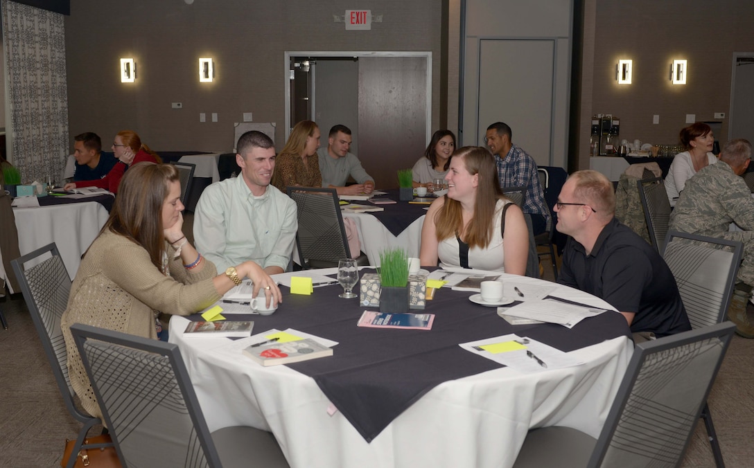 Couples from Ellsworth Air Force Base, S.D., converse amongst one another at the Rushmore Hotel in Rapid City, Sept. 23, 2016. Military couples were given the opportunity to meet and discuss the various challenges they have gone through and how to overcome the difficulties. (U.S. Air Force photo by Airman 1st Class Donald C. Knechtel)