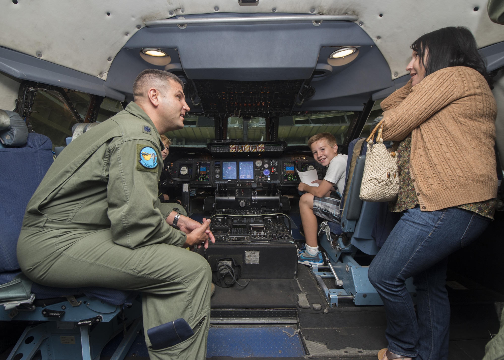 Lt. Col. Jacob Scherrer, 9th Airlift Squadron director of operations, talks to museum visitors during the Air Mobility Command Museum’s Festival of Flight 30th Anniversary celebration Sept. 24, 2016, inside a C-5M Super Galaxy flight deck at the AMC Museum on Dover Air Force Base, Del. The AMC Museum was conceptualized as the Dover Air Force Base Historical Center Oct. 13, 1986. (U.S. Air Force photo by Senior Airman Zachary Cacicia)