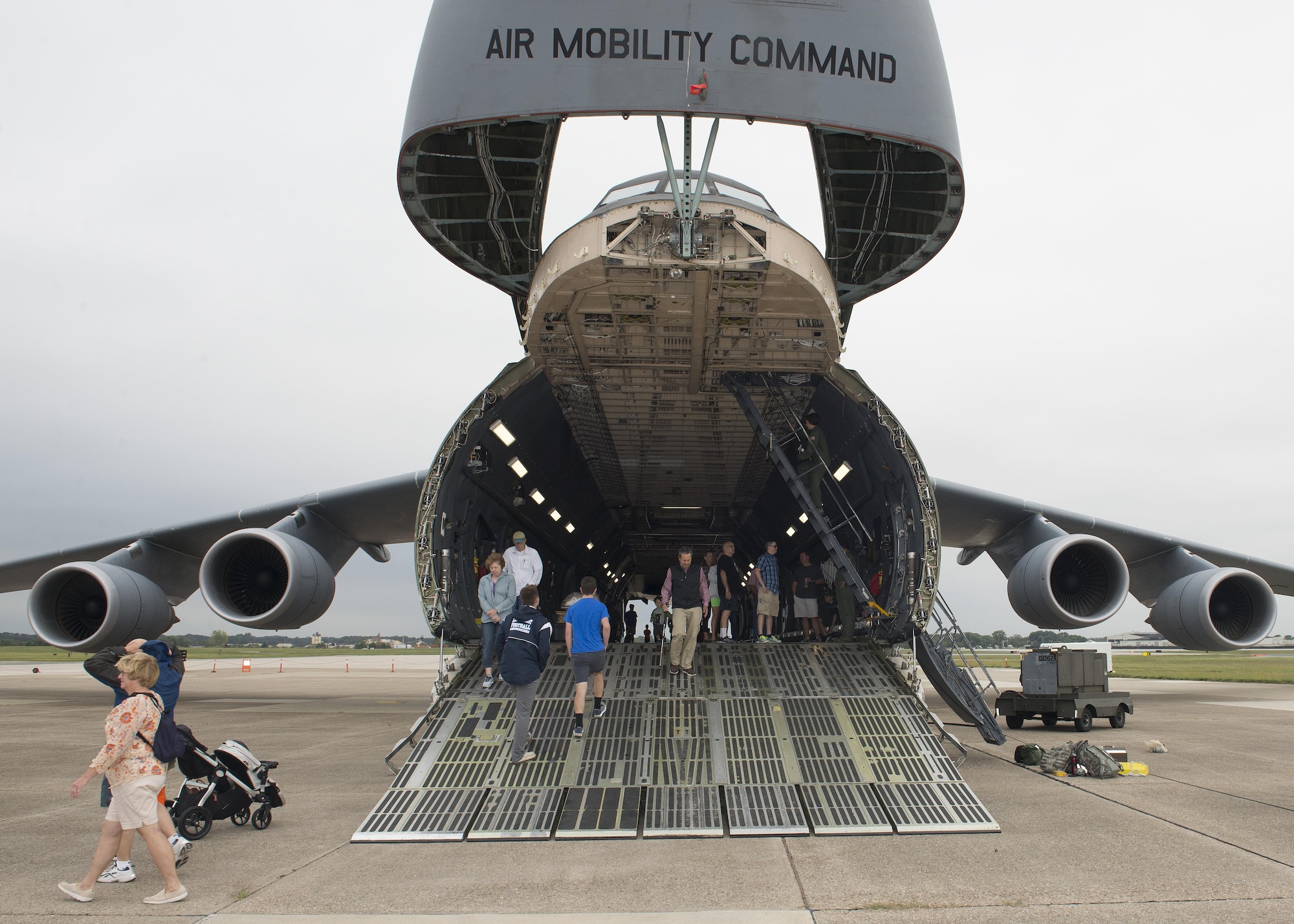 Museum visitors tour a Team Dover operational C-5M Super Galaxy during the Air Mobility Command Museum’s Festival of Flight 30th Anniversary celebration Sept. 24, 2016, at the AMC Museum on Dover Air Force Base, Del. Dover AFB provided this C-5M and an active duty C-17A Globemaster III for static display, open for public tours. (U.S. Air Force photo by Senior Airman Zachary Cacicia)