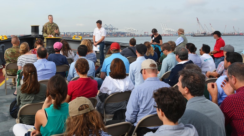 With Port Newark NJ in the background, Col. David Caldwell, Commander of the Army Corps' New York District aboard the Corps vessel MV Hayward addresses attendees during a September 2016 Harbor Inspection.  The inspection was conducted in the Port District which encompasses a 25-mile radius of the Statue of Liberty that includes a system of navigable waterways in the estuary where several USACE projects and studies are ongoing.  